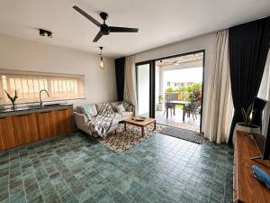 a living room with a couch and a table at Sea Esta in Le Morne