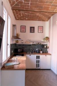 a kitchen with a sink and a counter top at Casa Matilde Rooms & Apartment in Bazzano Bologna +24 photos