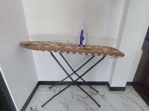 a table with a knife sitting on top of it at Ken Homestay Waikkala in Wayikkal