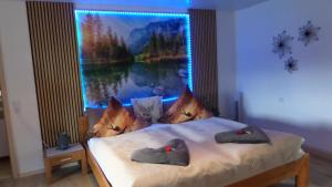 a bedroom with a bed with a large window at FW & FH Lüsselfeld in Zwiesel