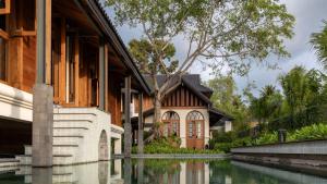 a house with a river in front of it at Siritarar Residence by Elite Havens in Nathon Bay