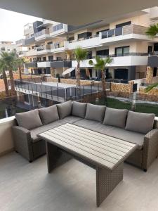 a couch on the balcony of a building at Casa Lauri in Orihuela Costa