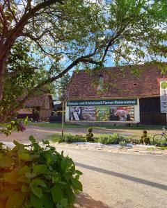 a building with a sign on the side of a street at Farmer-Rabensteiner in Bad Gams