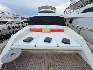 a bed on the deck of a boat at Yacht Laetitia Delta in Fréjus