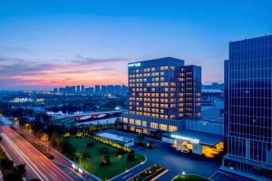 a view of a building in a city at night at Courtyard by Marriott Rizhao in Rizhao