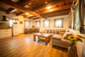 a living room with a couch and a table at Ubytování Pod Mostem in Broumov