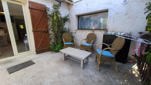 a group of chairs and a table on a patio at Campagne Carbonel in Aix-en-Provence +5 photos