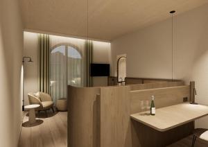 a kitchen with a counter with a bottle of wine at Terra Saar, Weinresort & Spa in Saarburg