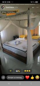 a picture of a bed in a room at Villa TSARAJORO in Toamasina