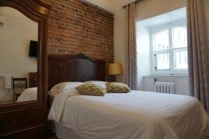 Postel nebo postele na pokoji v ubytování Hôtel Marie-Rollet