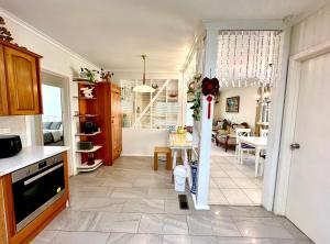 a kitchen with a living room and a dining room at Jalynn homestay in Glen Waverley
