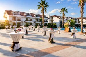 a set up for a wedding at a resort with palm trees at Tripolis Hotel in Pamukkale