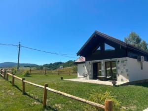 a small house with a fence in front of it at Montana Goc in Goč