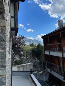 a view of the mountains from the balcony of a building at Apartamento El Gorgol in Tramacastilla de Tena