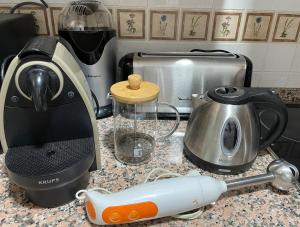 a kitchen counter with a blender and a toaster at Apartamento El Gorgol in Tramacastilla de Tena