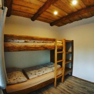 a bedroom with two bunk beds in a room at U Mikešů in Vyšší Brod