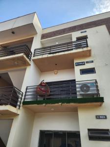a building with a balcony with a sign on it at De Atrium apartment in Galadima
