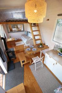 a living room with a bunk bed and a table at Tiny house U Dlouháče in Litoměřice