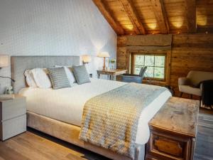 a bedroom with a large bed in a room at Arlberg View Residence in St. Moritz