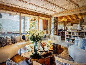a living room with a couch and a table at Arlberg View Residence in St. Moritz