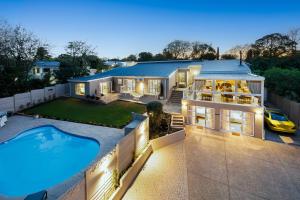 an aerial view of a house with a swimming pool at 17 On Cedar Boutique Guesthouse in Durbanville