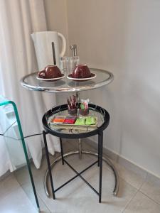 a glass table with two plates on top of it at 8 Guildford in George +2 photos