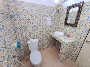 a bathroom with a toilet and a sink at Magic View Apartments Koh Tao in Ko Tao +46 photos