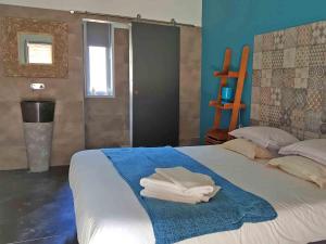 Postel nebo postele na pokoji v ubytování Hôtel Ascosa Aventure