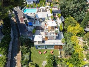 an aerial view of a mansion with a swimming pool at Villa Romy, a World apart in Roquebrune-Cap-Martin
