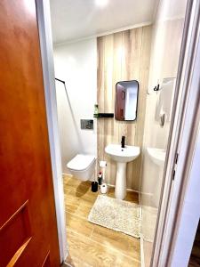 a small bathroom with a sink and a toilet at Studio Tatarskie,Parking! in Przemyśl
