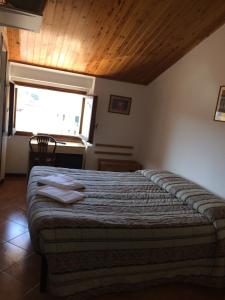 Postel nebo postele na pokoji v ubytování Hotel Bodoni