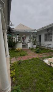 a view of a house with a yard at Bk House in Pointe-Noire