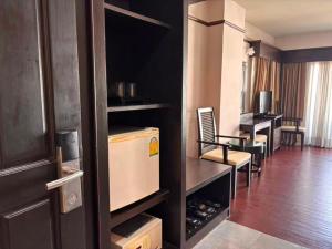 a hotel room with a room with a wine cellar at Sarita Chalet & Spa Jomtien beach Pattaya in Jomtien Beach
