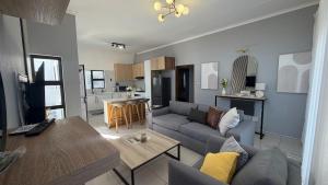 a living room with a couch and a table at Siwela in Darkton