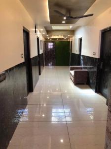 a hallway of a building with a ceiling at Hotel Famous in Haridwār