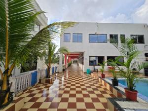 a resort with a checkered floor and a pool at JBL Beach Resort Mandarmoni in Mandarmoni