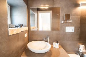 a bathroom with a sink and a mirror at Iulius Suite in Conversano +70 photos