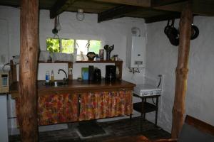 a kitchen with a counter with a sink and a window at La Lune De Boomgaard in Tripscompagnie