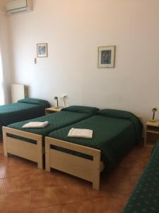 Postel nebo postele na pokoji v ubytování Hotel Bodoni