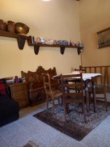 a dining room with a table and chairs at Casinha Meixedo in Bragança