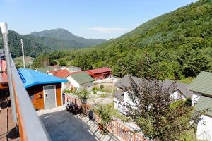 an aerial view of a small town with a mountain at Jeongsun Hayandom Pension in Jeongseon +20 photos
