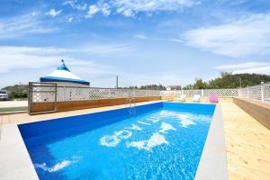 a swimming pool on the roof of a house at Samcheok santiago pension in Samcheok +5 photos