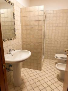 a bathroom with a sink and a toilet at Locanda Panorama Picerno in Picerno