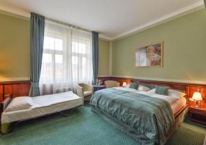 Posteľ alebo postele v izbe v ubytovaní Hotel Hastal Prague Old Town