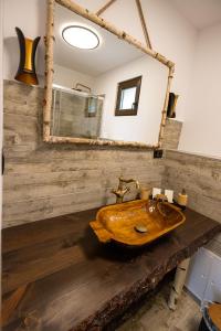 a bathroom with a wooden sink and a mirror at Villa Siana in Bran +81 photos