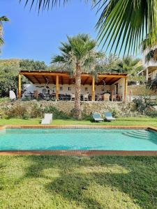 a swimming pool in front of a house at B&B La Nava Suites in Mojácar +37 photos
