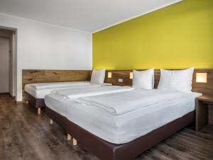 Postel nebo postele na pokoji v ubytování Basic Hotel Innsbruck