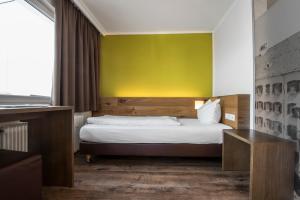 Postel nebo postele na pokoji v ubytování Basic Hotel Innsbruck