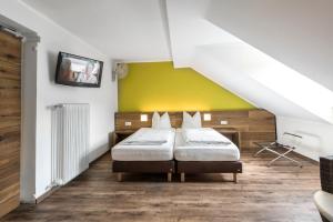 Postel nebo postele na pokoji v ubytování Basic Hotel Innsbruck