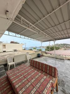 a couch on the roof of a building at Yalçın Pansiyon in Silifke +15 photos